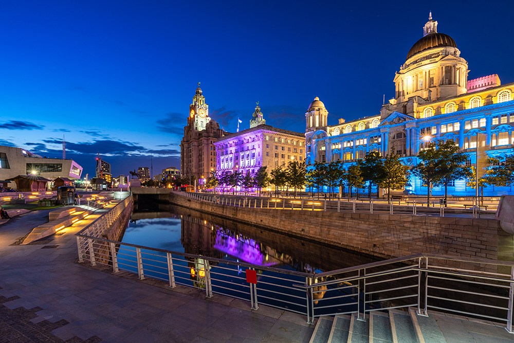 Liverpool Skyline building at Pier head and alber dock at sunset dusk, Liverpool England UK.